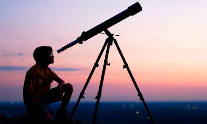 A person using a telescope